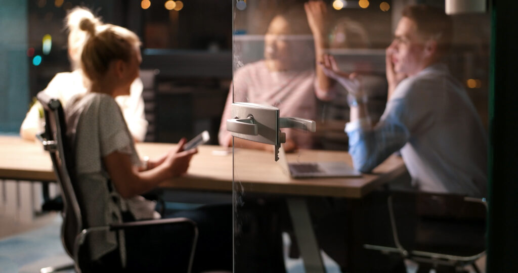 Business Meeting with technology taking place.